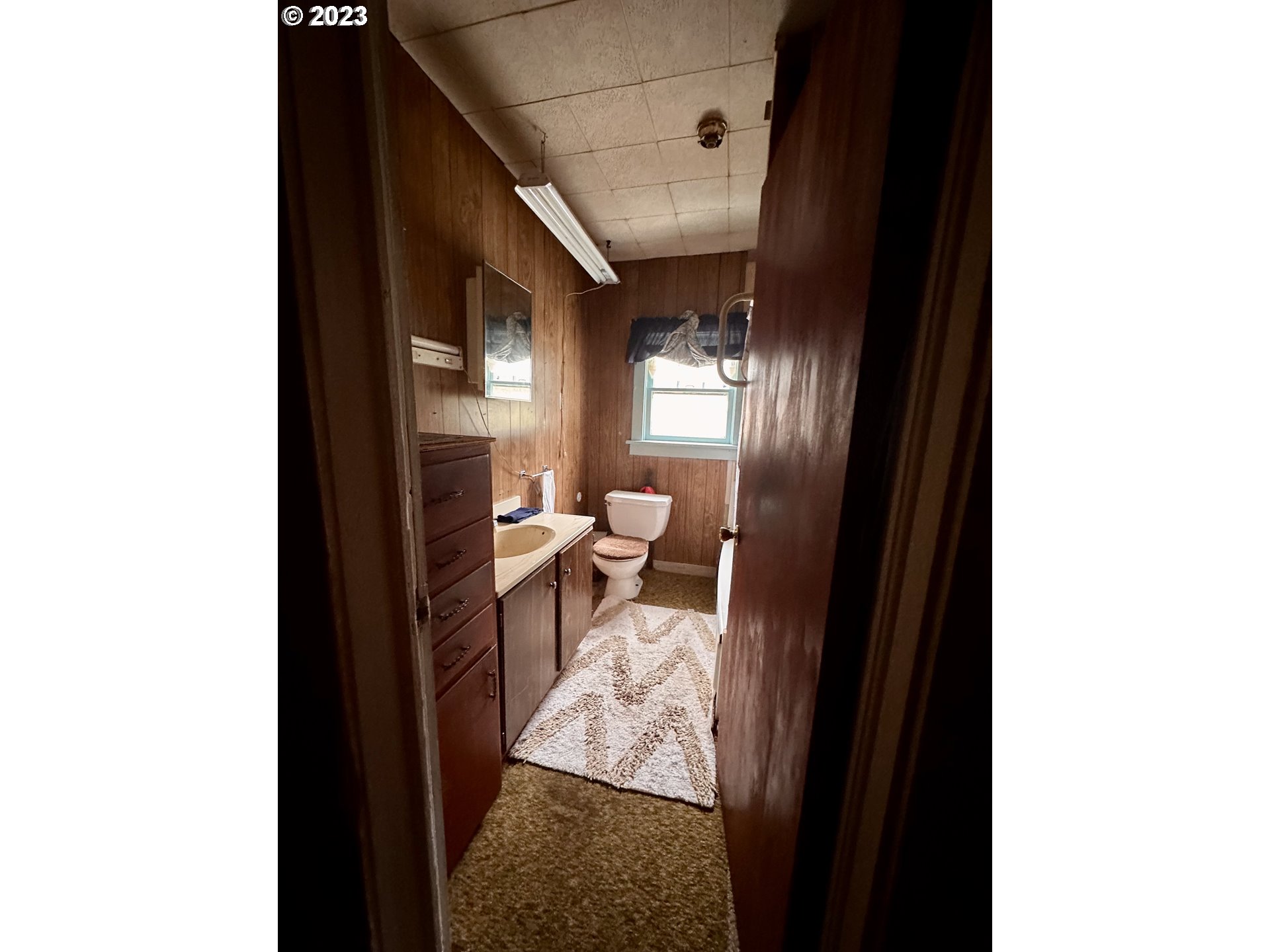 37681 Row River Road Dorena, OR 97434 - Photo 11 of 16 a view of a hallway and a livingroom with furniture
