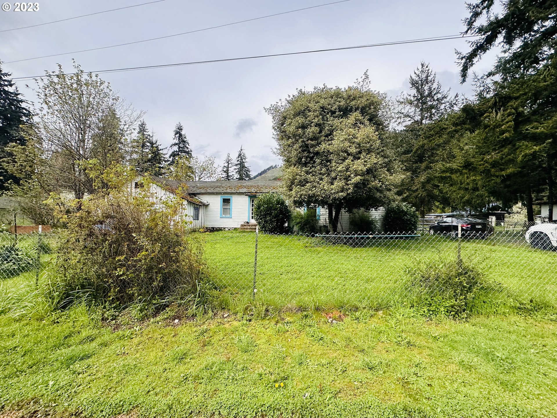 37681 Row River Road Dorena, OR 97434 - Photo 13 of 16 a view of a backyard with a garden