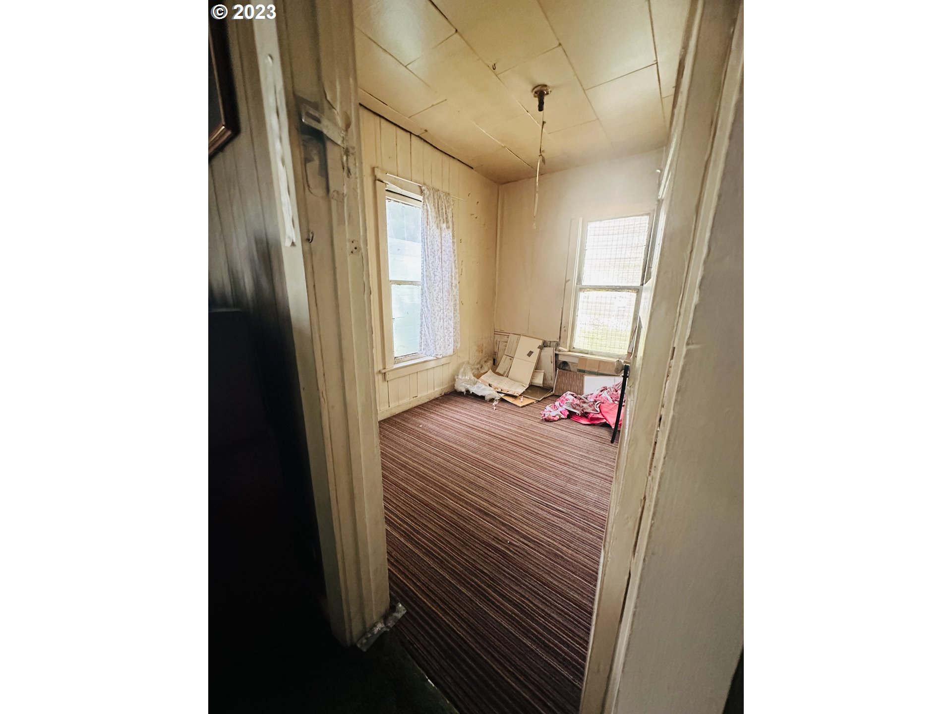 37681 Row River Road Dorena, OR 97434 - Photo 16 of 16 a bedroom with a bed and a mirror