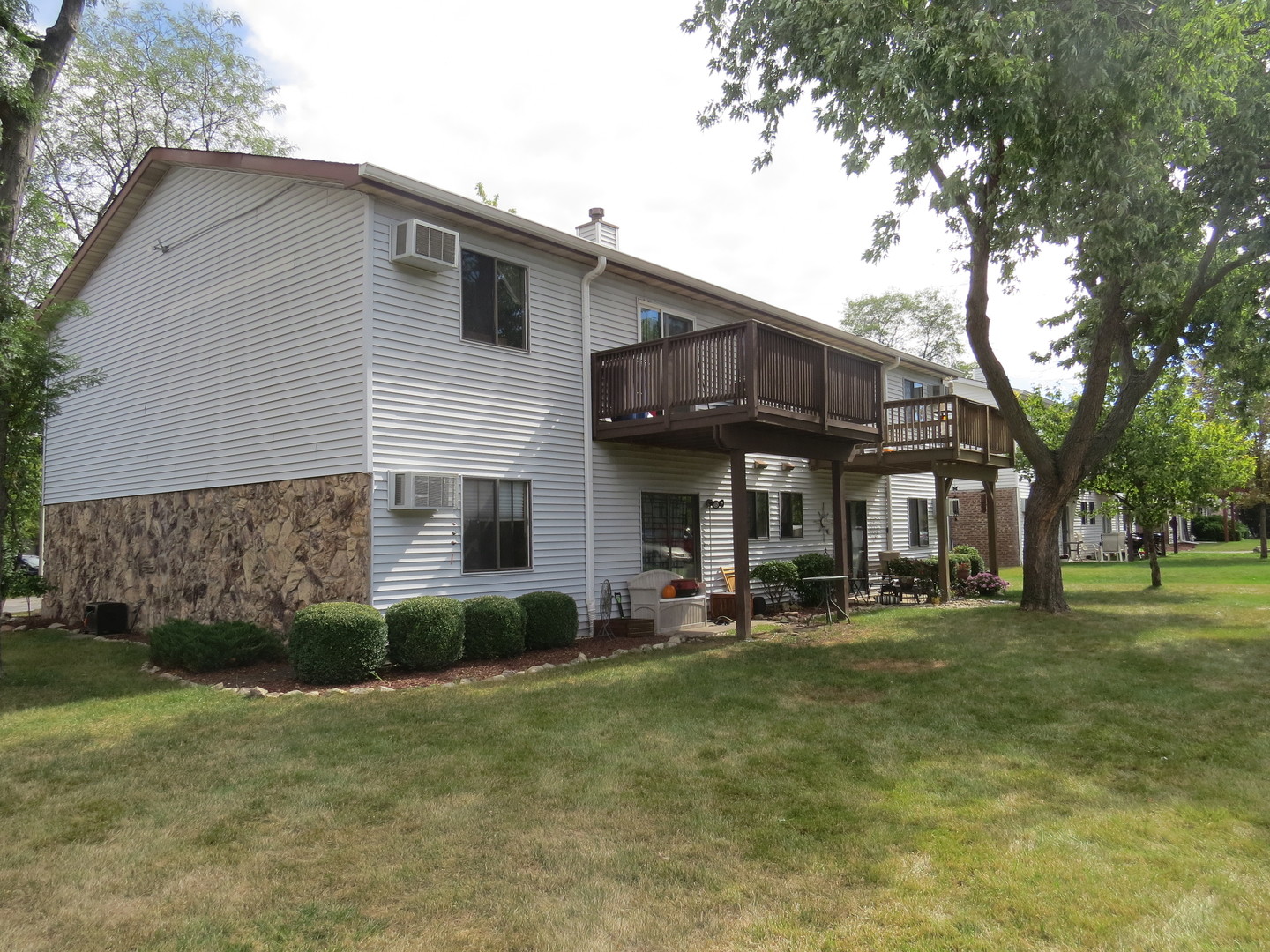 396 Echo Lane, Unit 3 Aurora, IL 60504 - Photo 16 of 20 a front view of a house with a yard