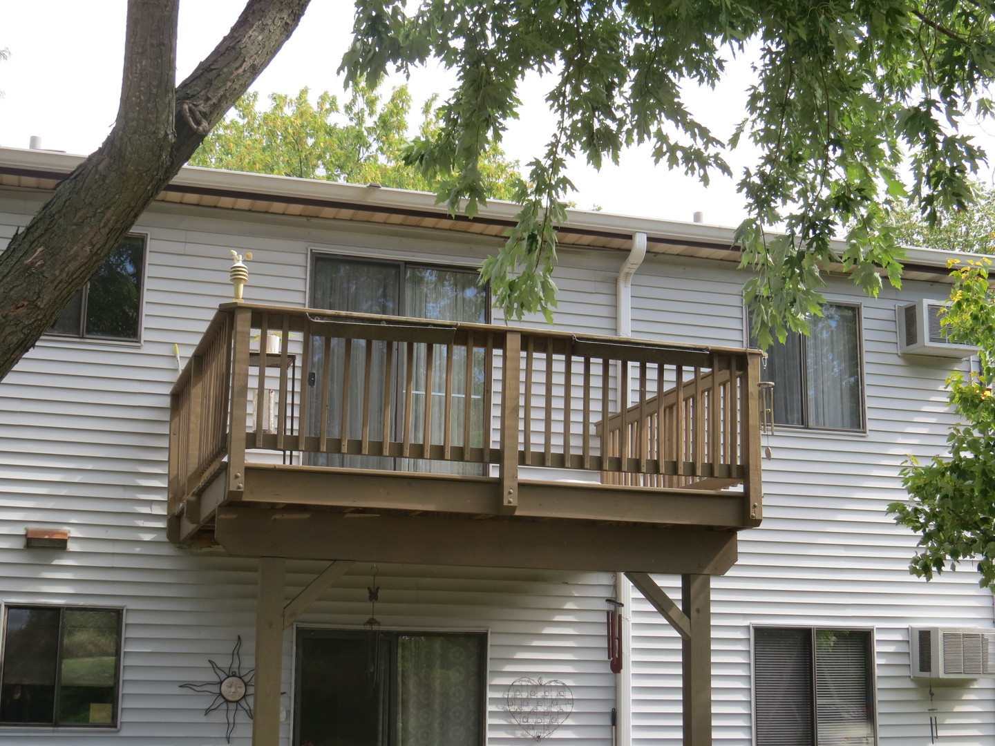 396 Echo Lane, Unit 3 Aurora, IL 60504 - Photo 17 of 20 a balcony with a table and chairs