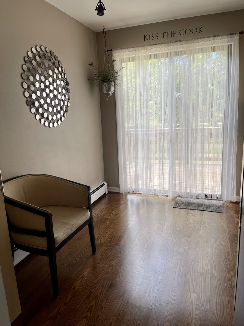 396 Echo Lane, Unit 3 Aurora, IL 60504 - Photo 7 of 20 a view of room with furniture wooden floor and window