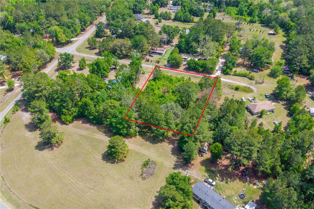 5781 Southwest 91st Place Lake Butler, FL 32054 - Photo 2 of 6 an aerial view of a houses with a yard