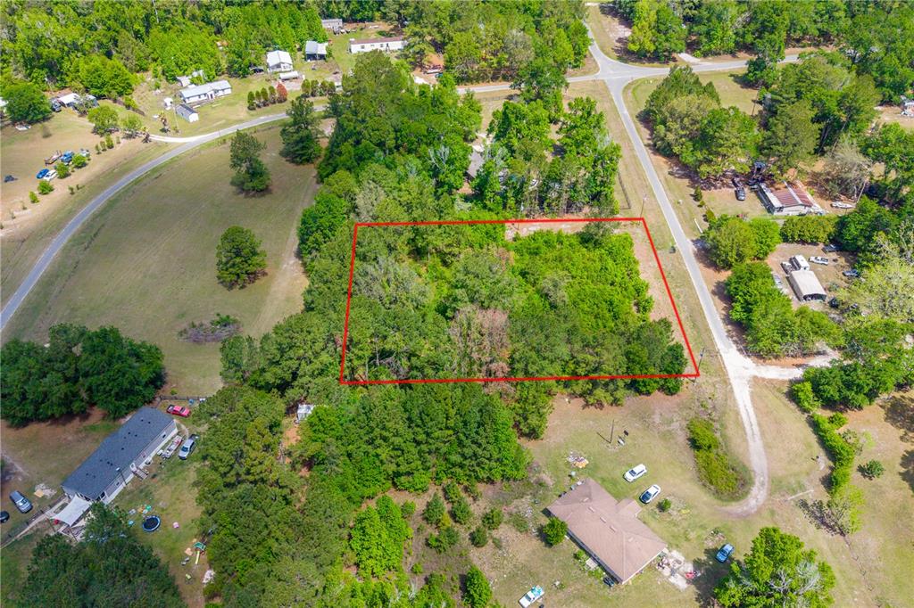 5781 Southwest 91st Place Lake Butler, FL 32054 - Photo 4 of 6 an aerial view of lake residential house with outdoor space and trees all around