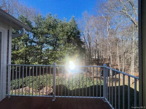 a view of balcony with wooden floor