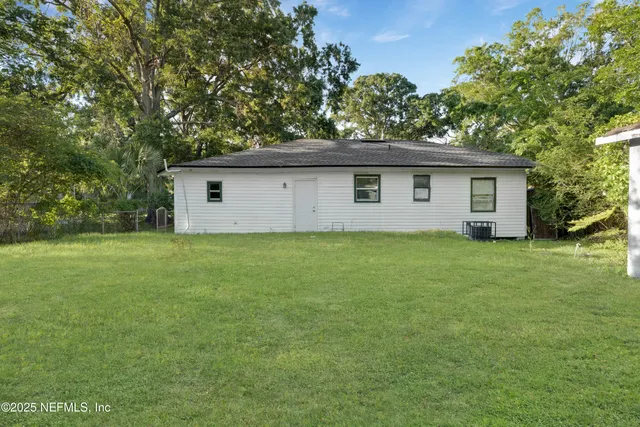 a house with a tree in front of it