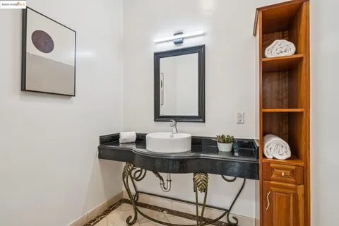 a view of a livingroom with wooden floor and a rug