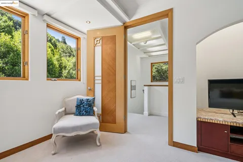 a bedroom with bed and wooden floor