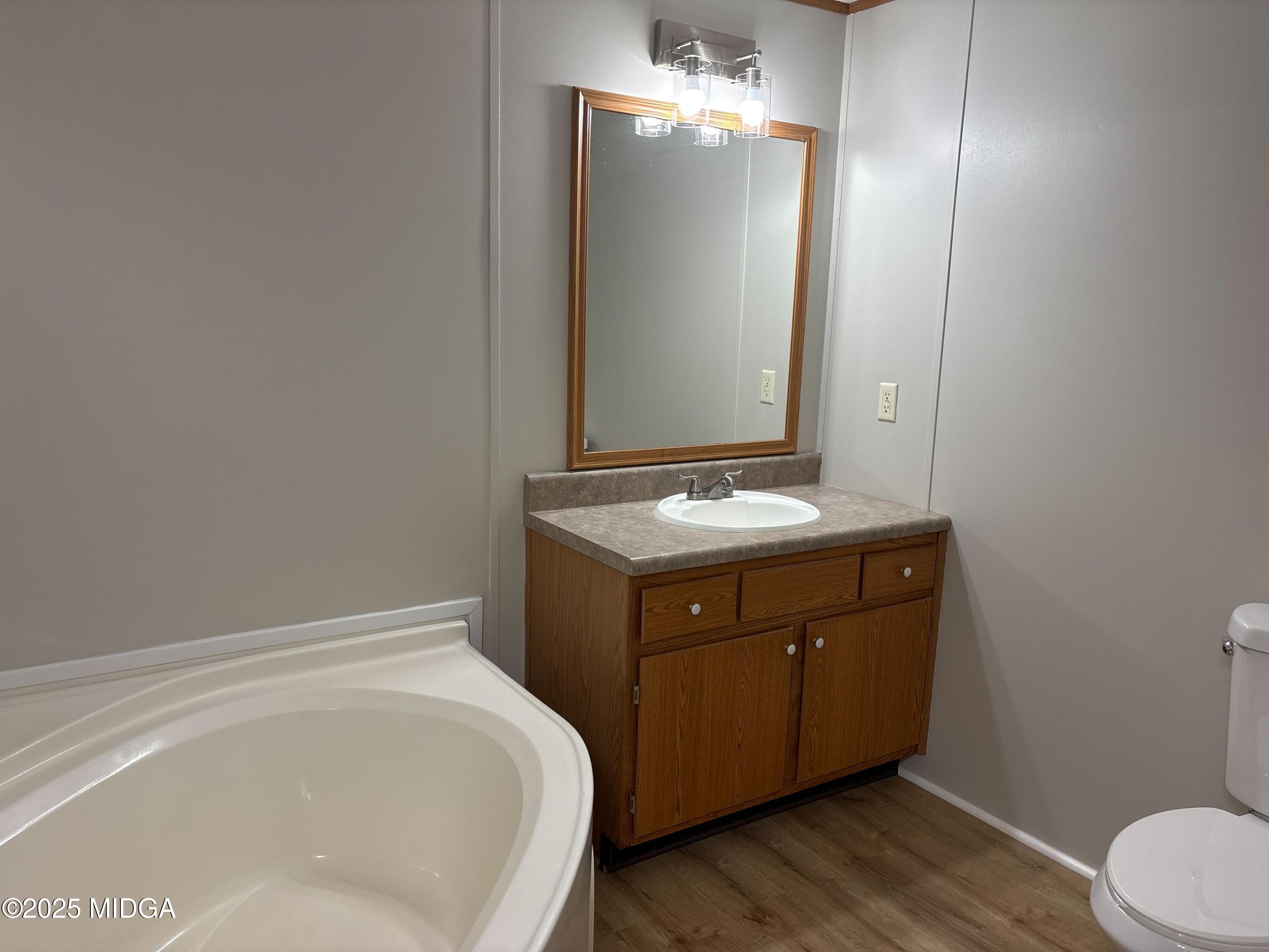 137 Alview Drive Macon, GA 31206 - Photo 12 of 22 a bathroom with a tub sink and mirror