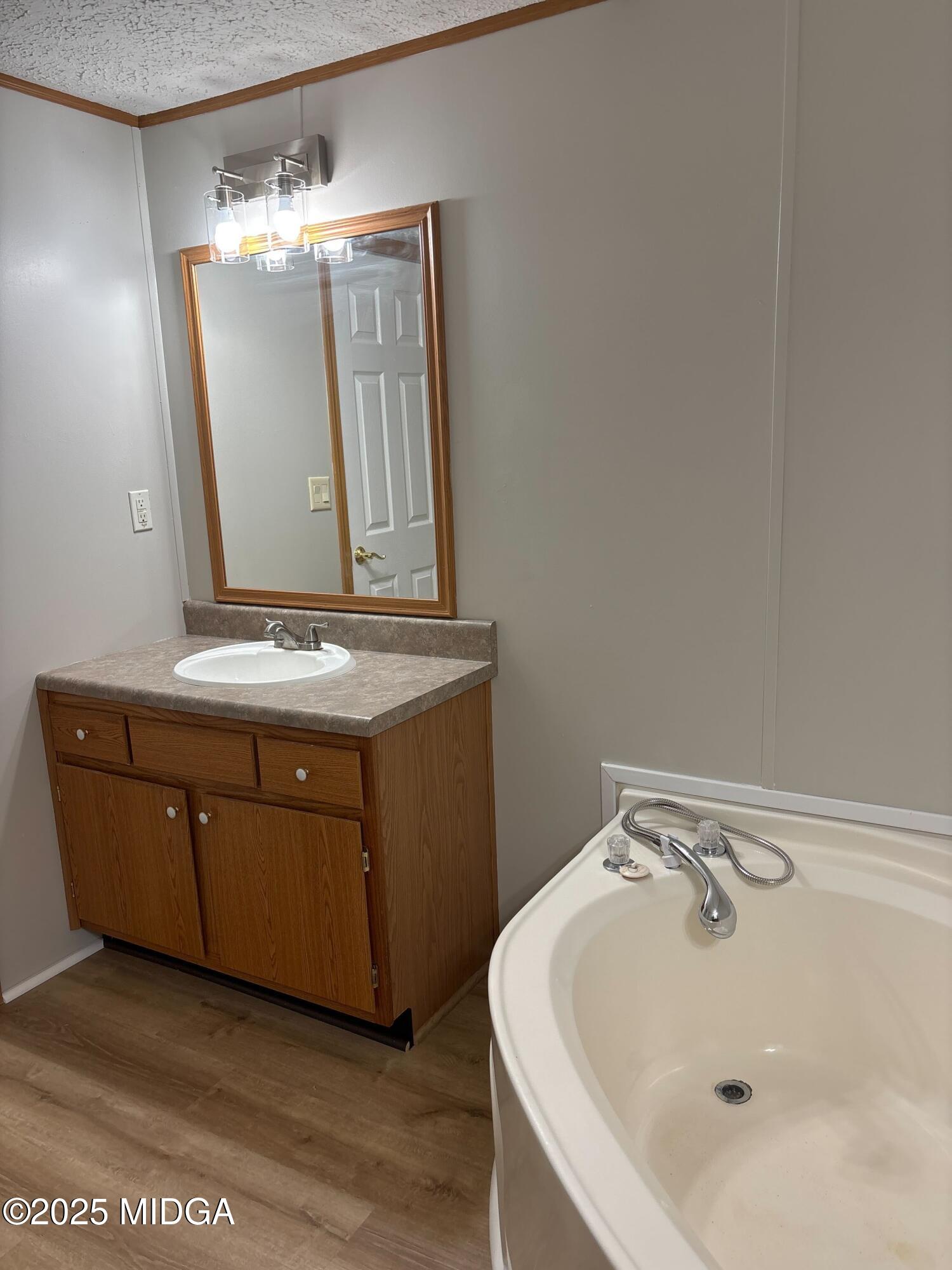 137 Alview Drive Macon, GA 31206 - Photo 13 of 22 a bathroom with a sink and mirror