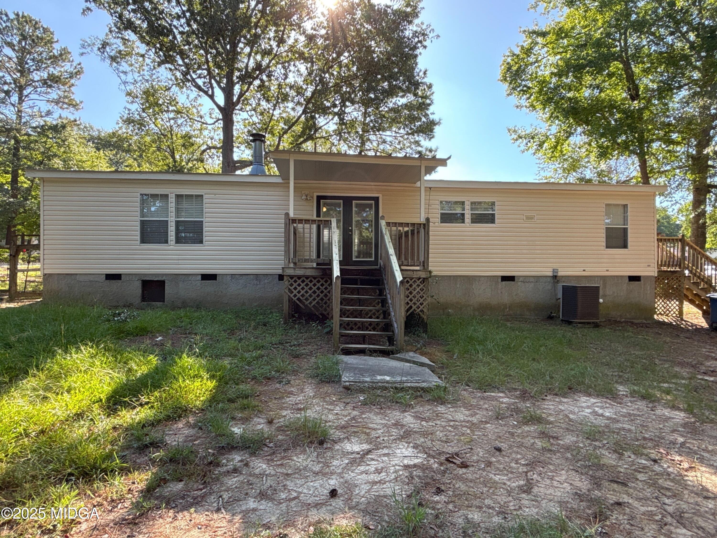 137 Alview Drive Macon, GA 31206 - Photo 21 of 22 a view of a house with a yard and large tree