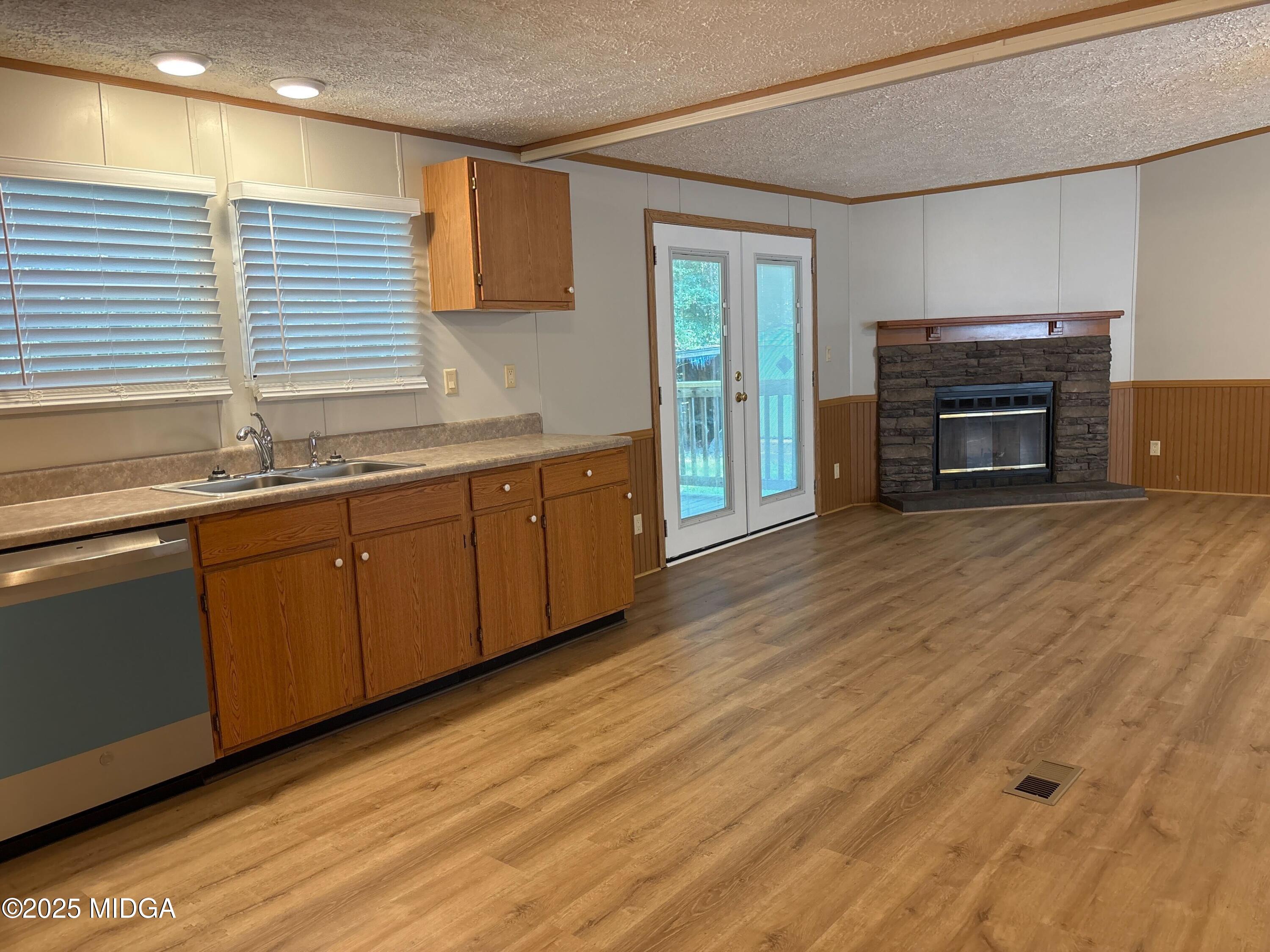 137 Alview Drive Macon, GA 31206 - Photo 8 of 22 a view of a kitchen with a sink and a fireplace