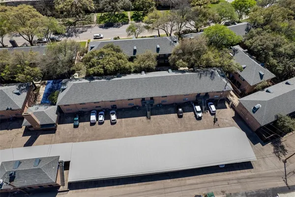an aerial view of a house with outdoor space patio and trees