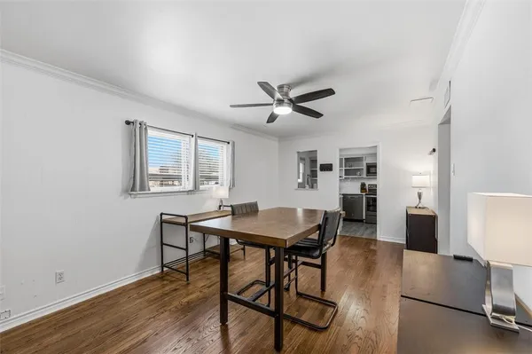 a view of a dining room with furniture and a wooden floor