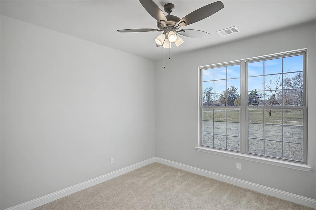 44 Karol Jean Way Quinlan, TX 75474 - Photo 19 of 36 Unfurnished room featuring light colored carpet and ceiling fan