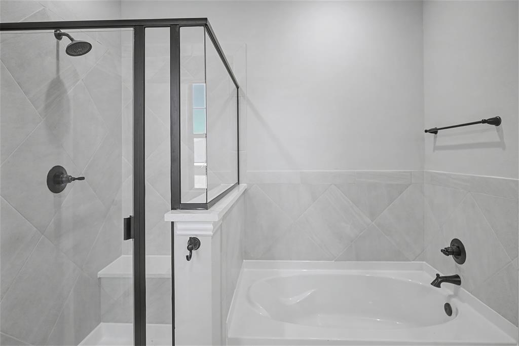 44 Karol Jean Way Quinlan, TX 75474 - Photo 20 of 36 Bathroom featuring a shower stall and a bath