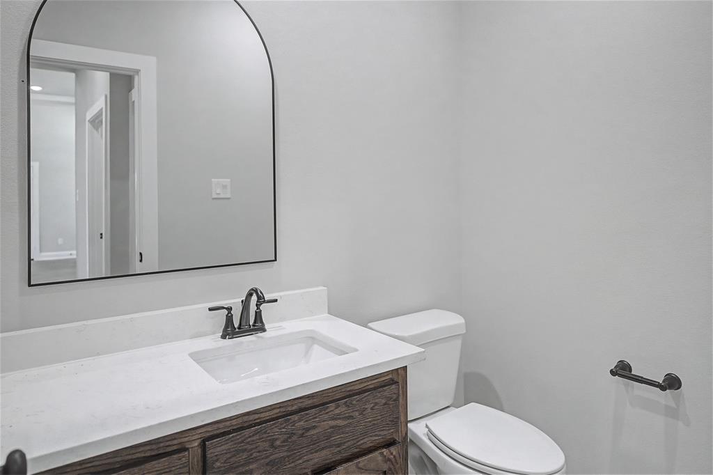 44 Karol Jean Way Quinlan, TX 75474 - Photo 21 of 36 Half bath with vanity and toilet
