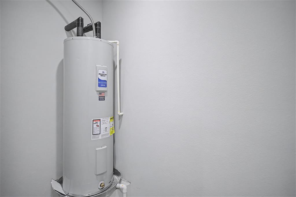 44 Karol Jean Way Quinlan, TX 75474 - Photo 27 of 36 Utility room with water heater