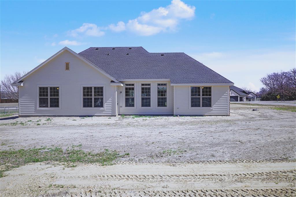 44 Karol Jean Way Quinlan, TX 75474 - Photo 28 of 36 Rear view of property featuring roof with shingles