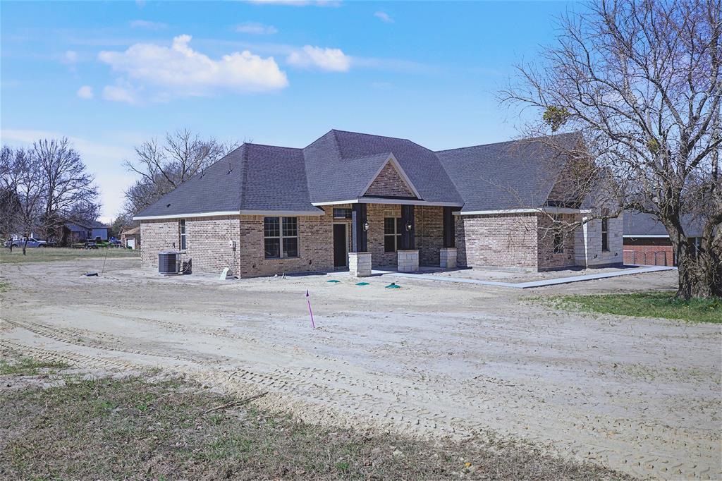 44 Karol Jean Way Quinlan, TX 75474 - Photo 3 of 36 View of front of property with brick siding, roof with shingles, and a porch