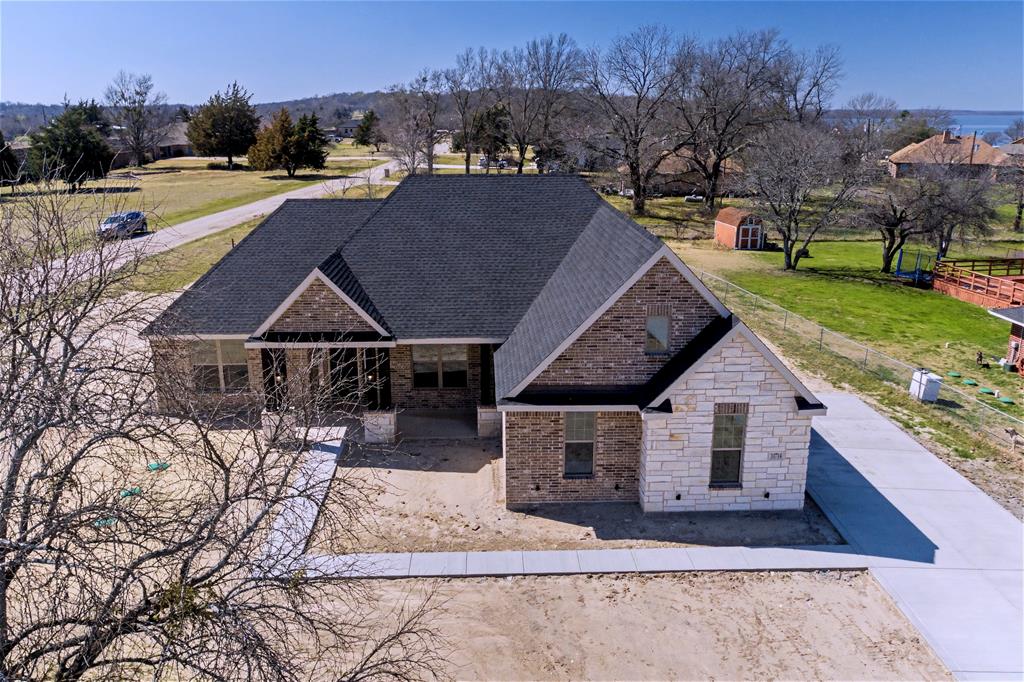 44 Karol Jean Way Quinlan, TX 75474 - Photo 5 of 36 View of front of house with brick siding, roof with shingles, and a front lawn