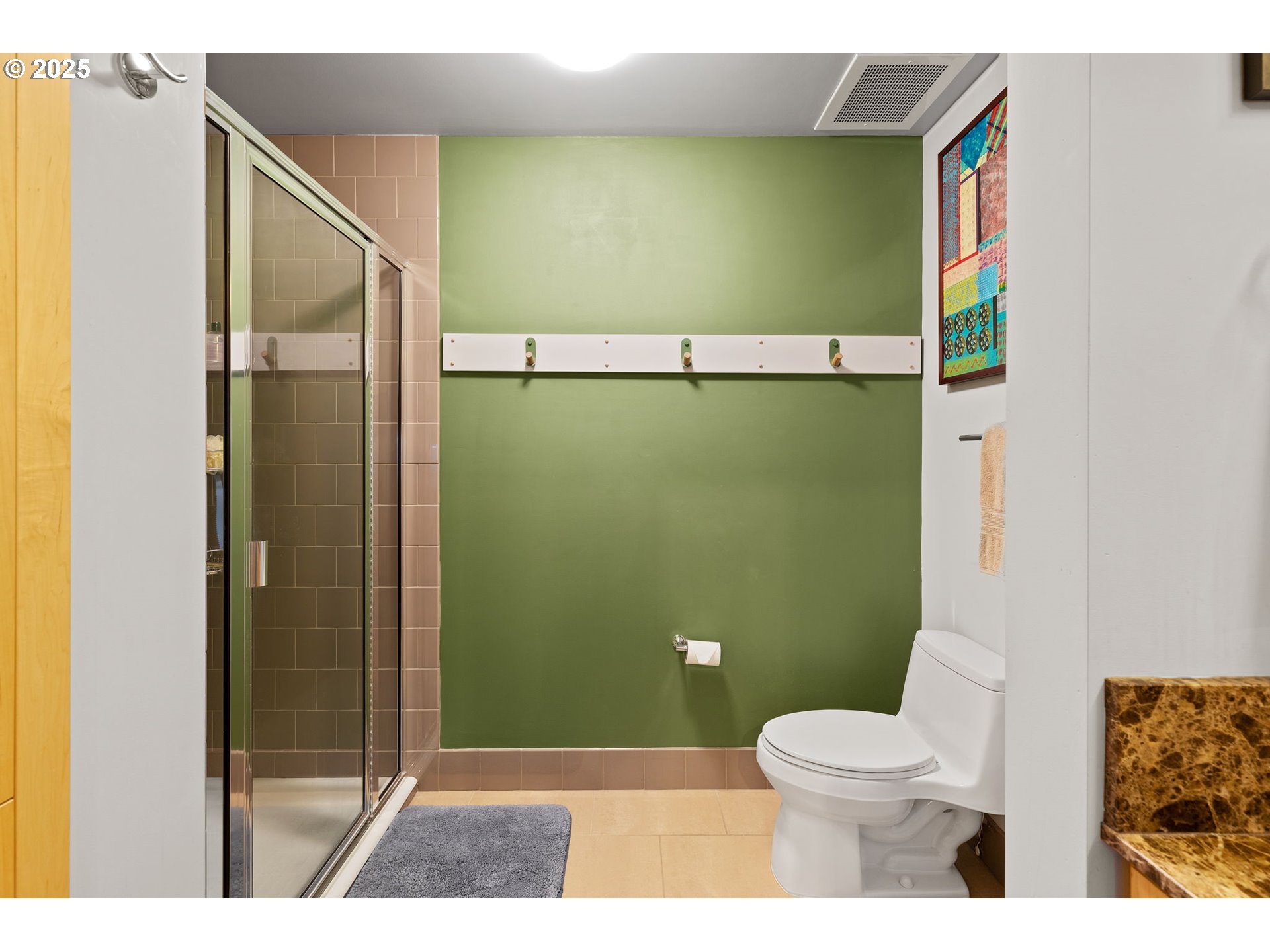 1221 Southwest 10th Avenue, Unit 809 Portland, OR 97205 - Photo 15 of 39 a bathroom with a toilet and a shower