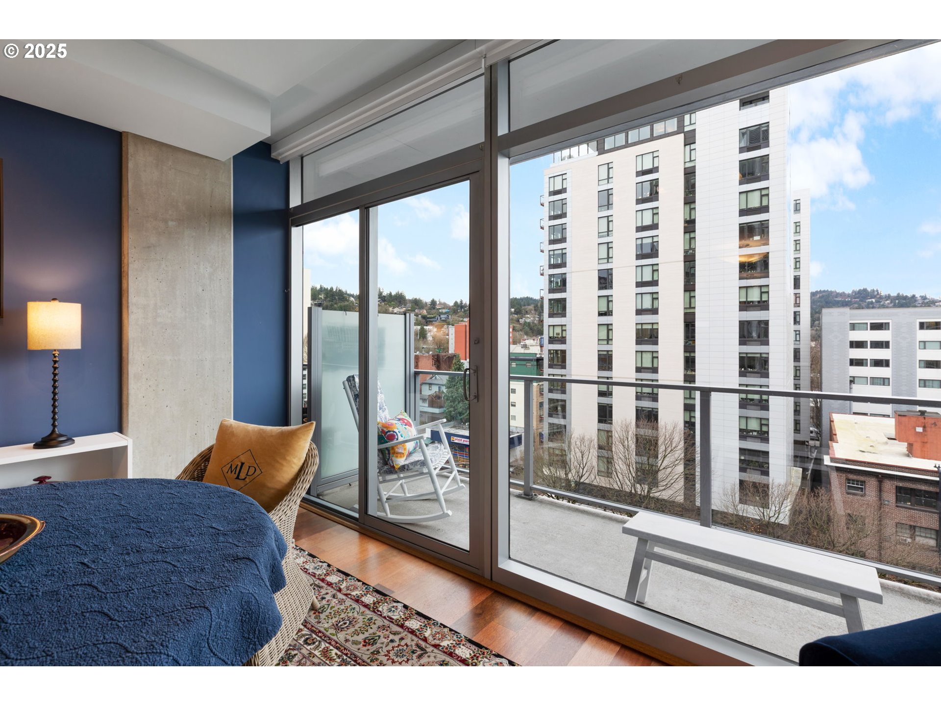 1221 Southwest 10th Avenue, Unit 809 Portland, OR 97205 - Photo 17 of 39 a living room with furniture and a floor to ceiling window