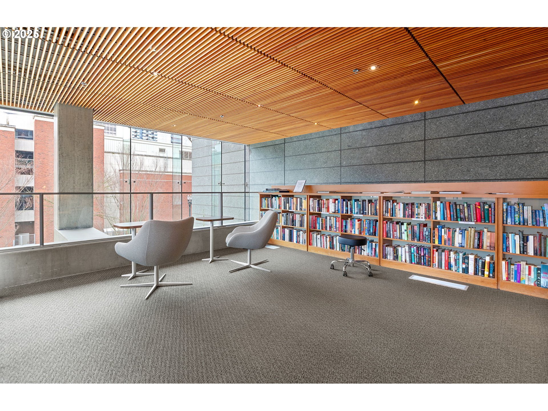 1221 Southwest 10th Avenue, Unit 809 Portland, OR 97205 - Photo 32 of 39 a reading room with furniture and a book shelf