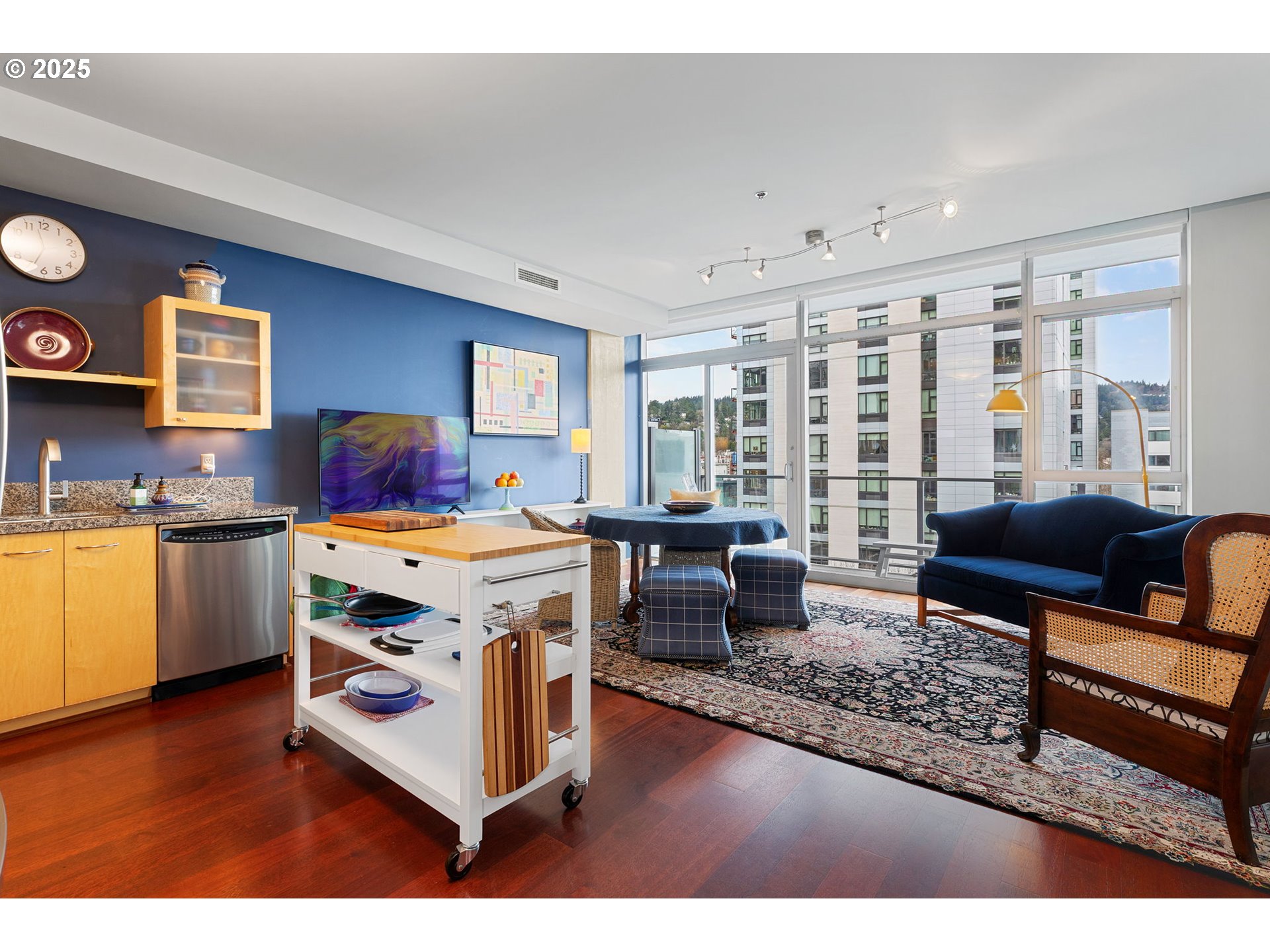 1221 Southwest 10th Avenue, Unit 809 Portland, OR 97205 - Photo 8 of 39 a living room with furniture and a kitchen view