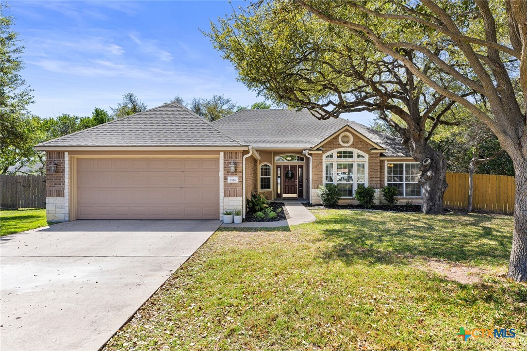 5816 Butterfly Court Temple, TX 76502 - Photo 1 of 1 a front view of a house with a garden and yard