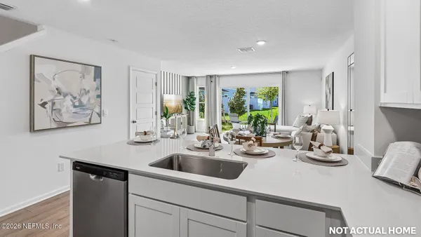 a kitchen with a sink cabinets and window