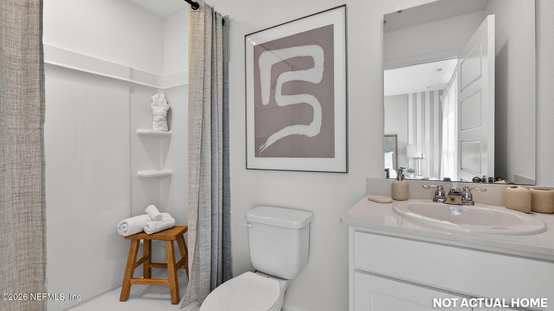 3601 Prancer Point Middleburg, FL 32068 - Photo 19 of 38 a bathroom with a toilet sink and mirror