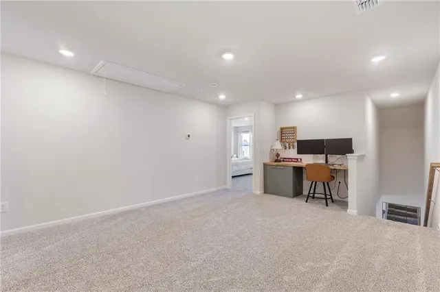 a room with furniture and a flat screen tv