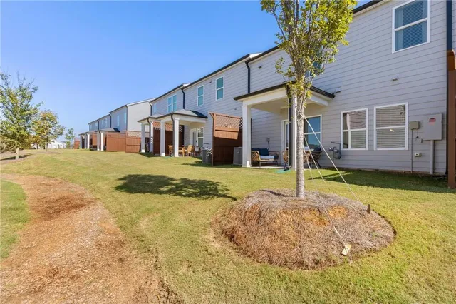 an aerial view of a house with a swimming pool