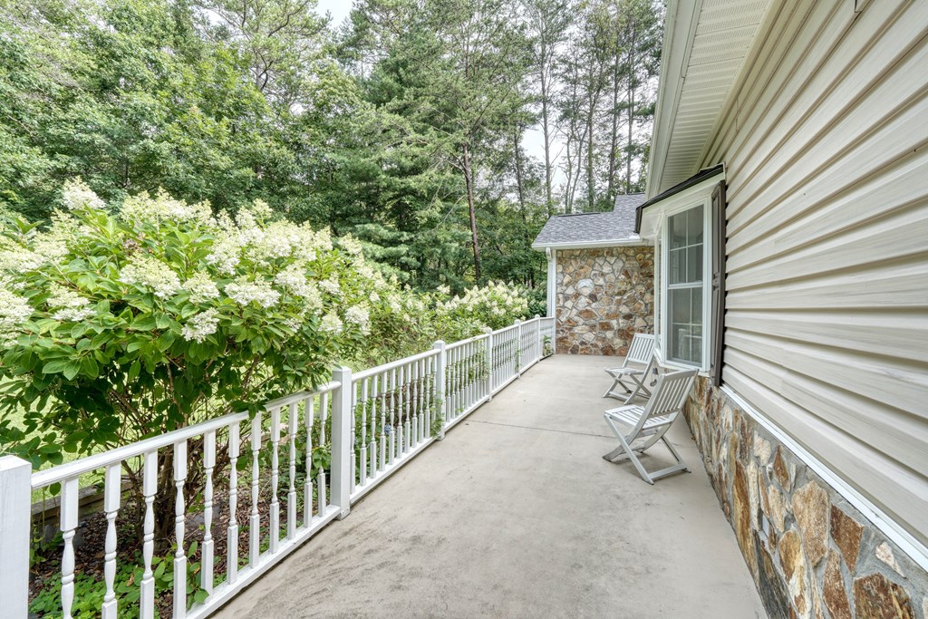 79 Mashie Lane Murphy, NC 28906 - Photo 16 of 76 a view of a porch with wooden floor and fence