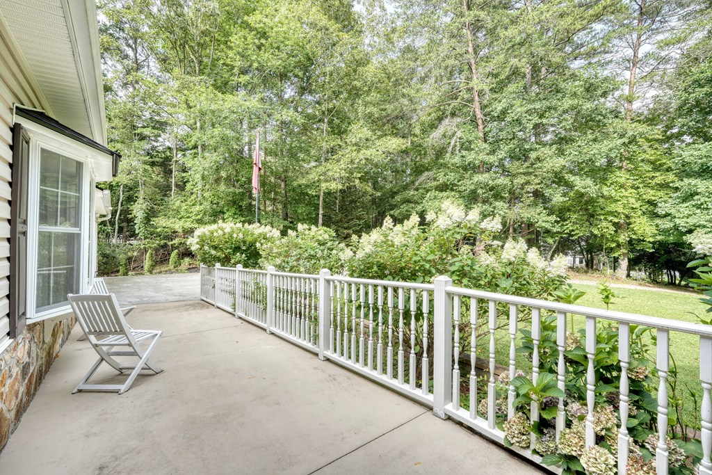 79 Mashie Lane Murphy, NC 28906 - Photo 17 of 76 a view of a chair and tables in the balcony