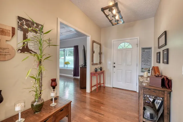 a kitchen with stainless steel appliances granite countertop a sink stove and microwave