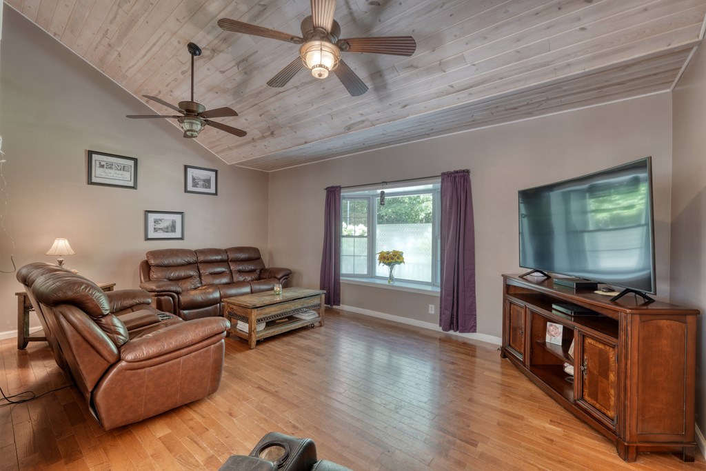 79 Mashie Lane Murphy, NC 28906 - Photo 20 of 76 a living room with furniture and a flat screen tv