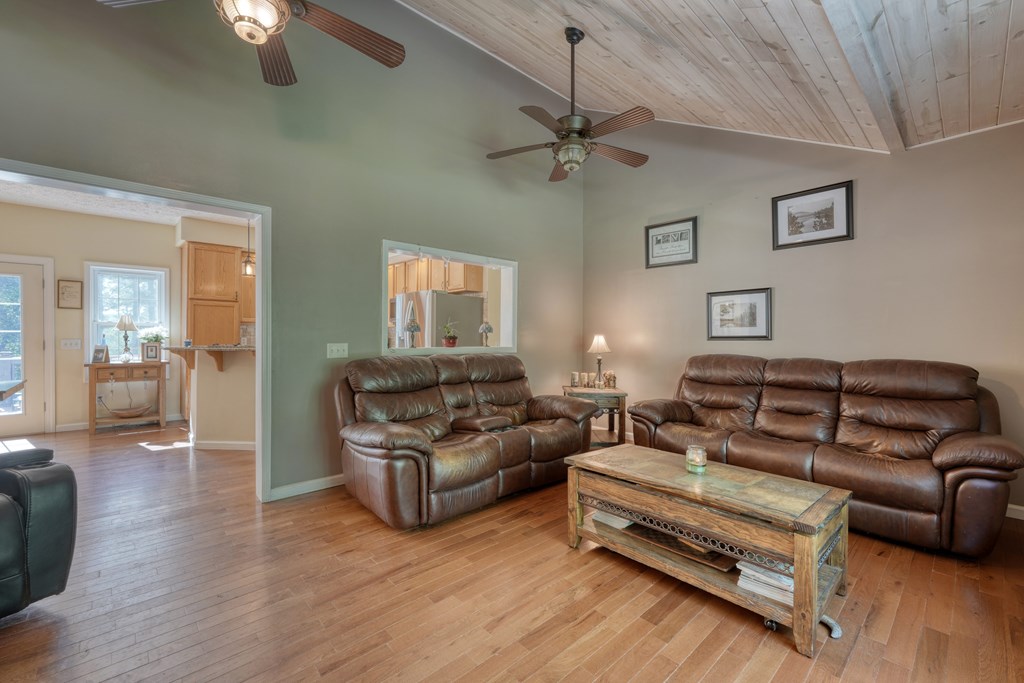 79 Mashie Lane Murphy, NC 28906 - Photo 21 of 76 a living room with furniture and a wooden floor