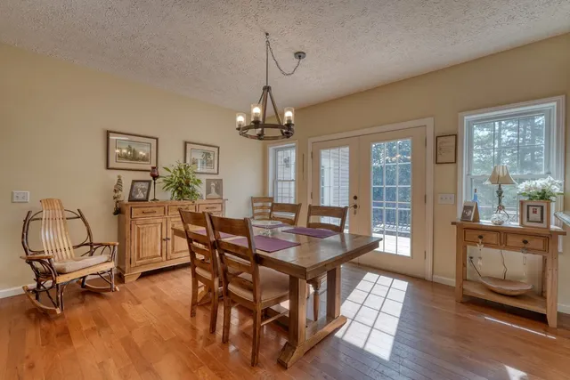 a bathroom with a tub and a window