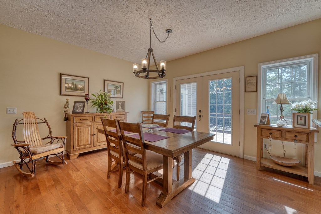 79 Mashie Lane Murphy, NC 28906 - Photo 23 of 76 a view of a dining room with furniture window and wooden floor