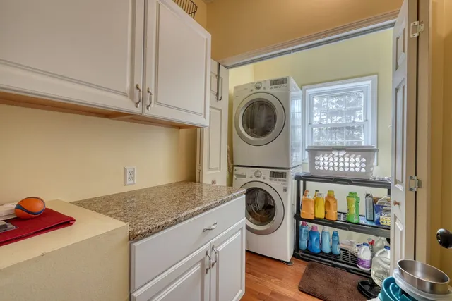 a bed room with a bed and a chandelier