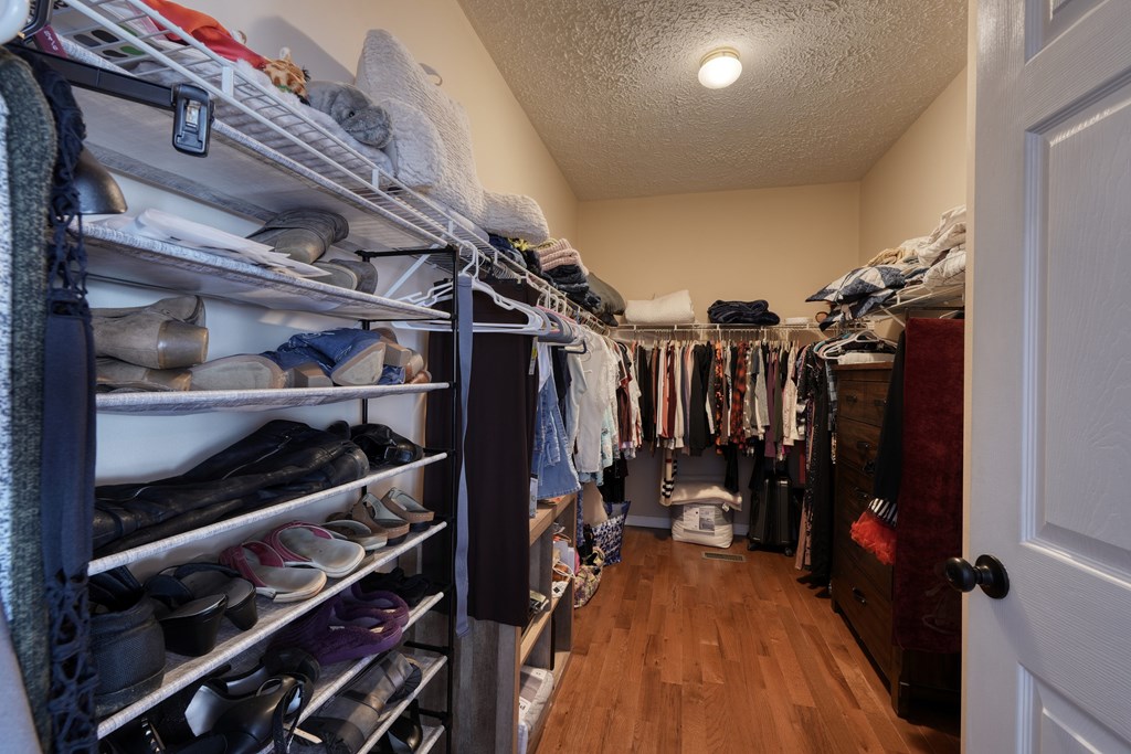 79 Mashie Lane Murphy, NC 28906 - Photo 36 of 76 a view of walk in closet with clothes and shoes