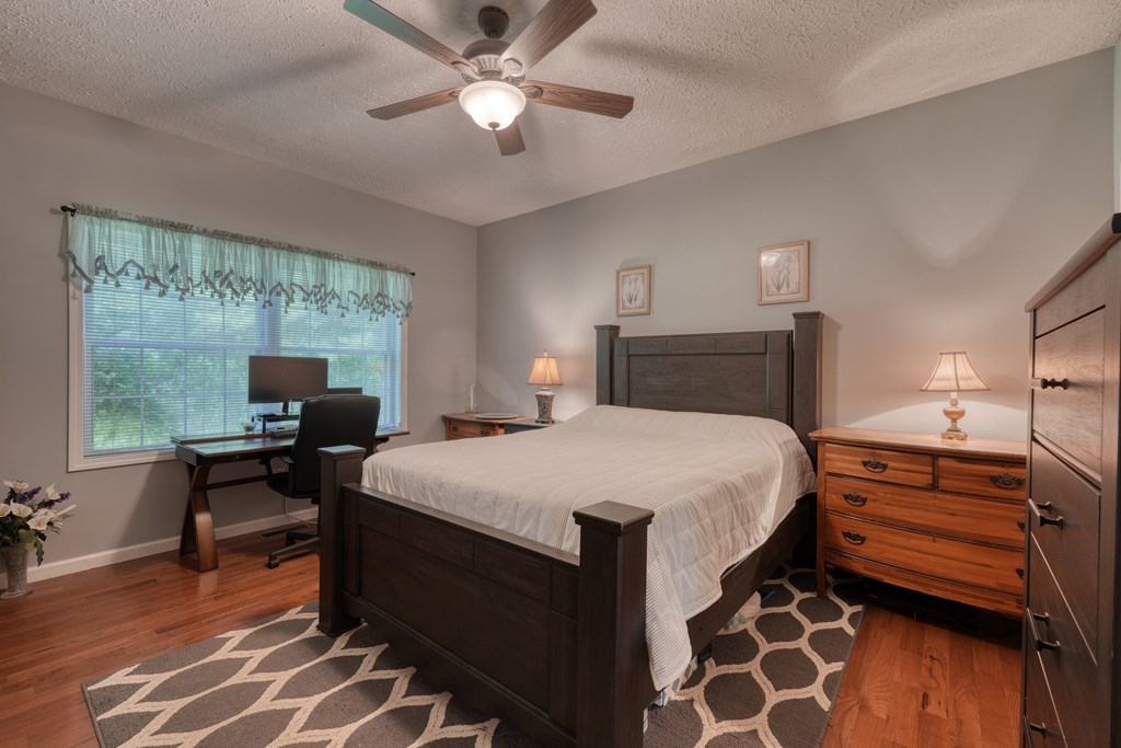 79 Mashie Lane Murphy, NC 28906 - Photo 37 of 76 a bedroom with a bed and a desk