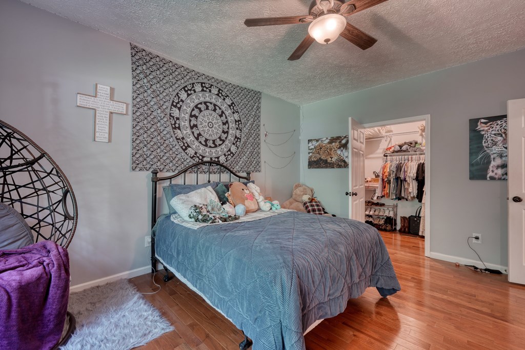 79 Mashie Lane Murphy, NC 28906 - Photo 43 of 76 a bed room with a bed and a chandelier