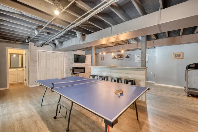 a view of a chairs and table in the backyard