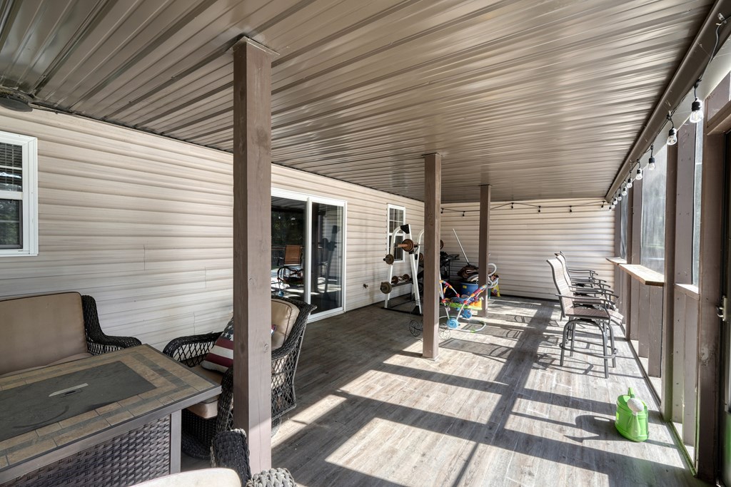 79 Mashie Lane Murphy, NC 28906 - Photo 59 of 76 a view of a patio with chairs and potted plants