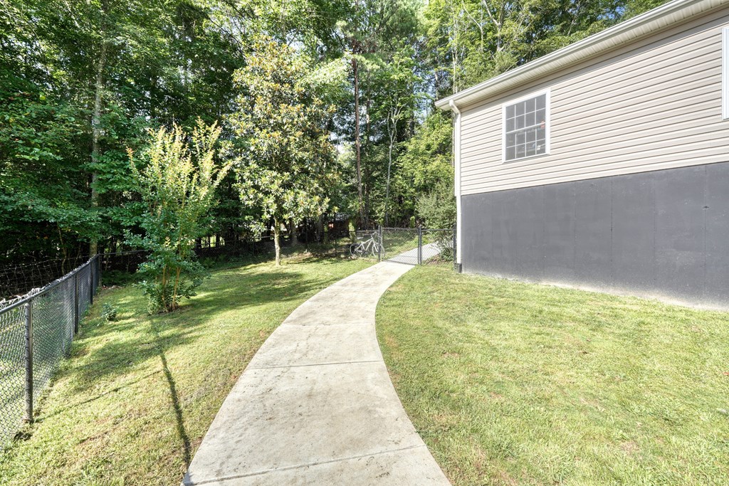 79 Mashie Lane Murphy, NC 28906 - Photo 67 of 76 a backyard of a house with lots of green space and plants