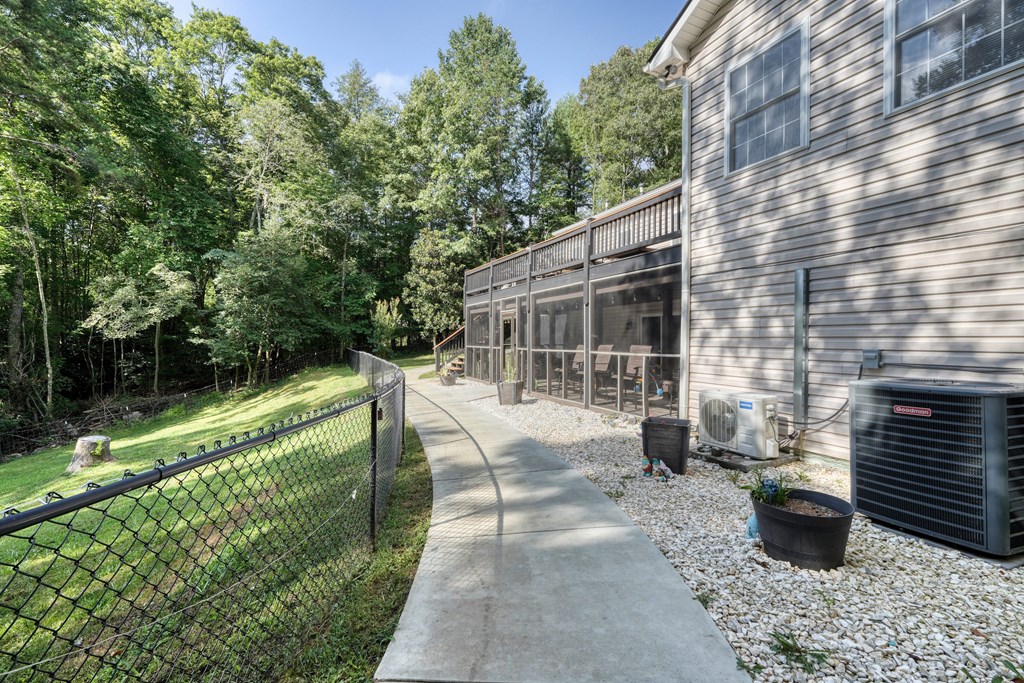 79 Mashie Lane Murphy, NC 28906 - Photo 68 of 76 a view of a patio with chair and tables back yard of the house