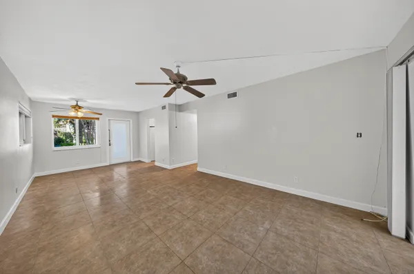a view of empty room with windows